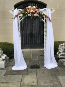 $297 - ceremony rental arch (included), draping, florals